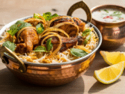 Best Chicken biryani dish Recipe For You – This is The Original!! Authentic chicken biryani dish served in a copper handi with saffron rice, fried onions, and herbs"